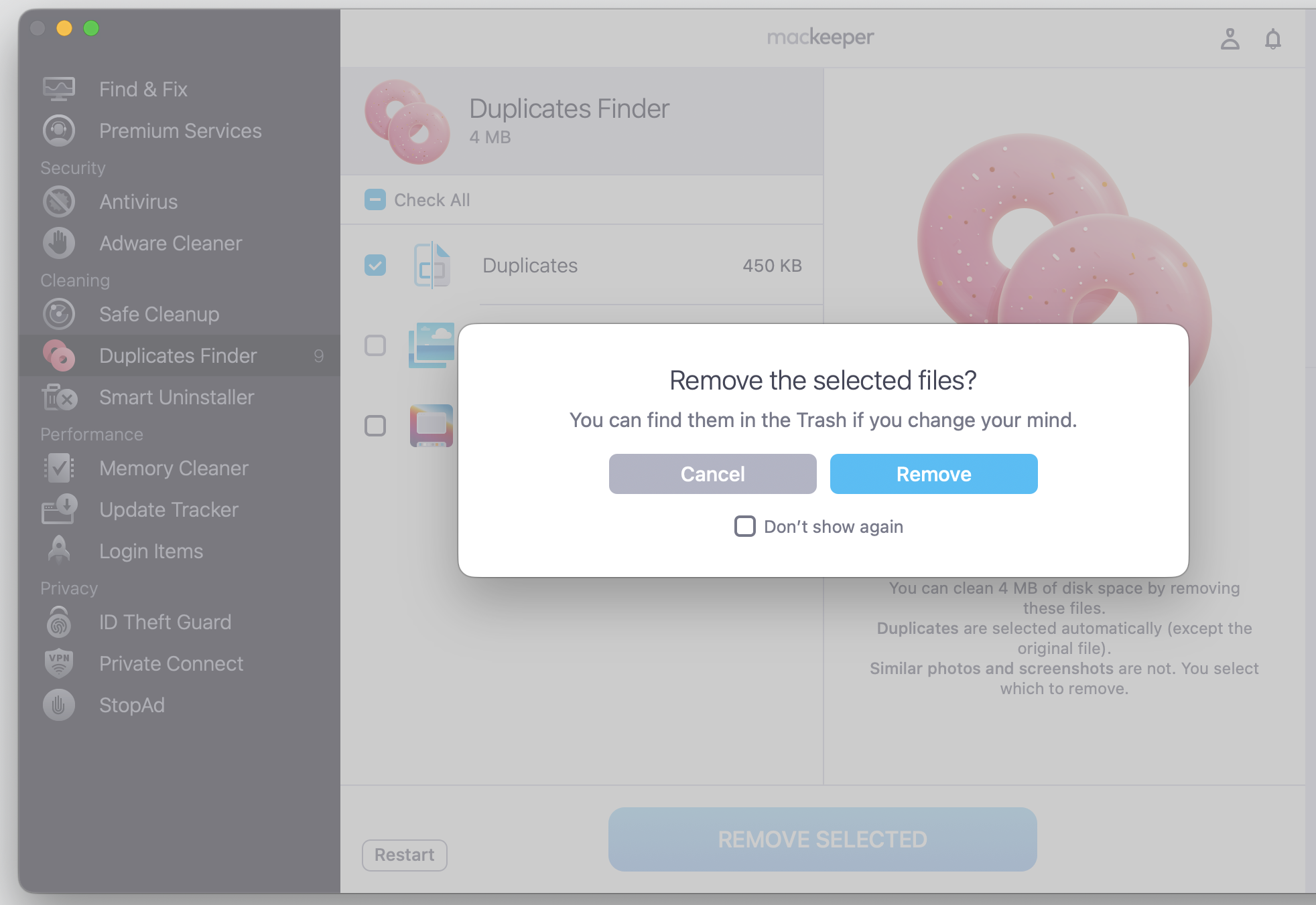 MacKeeper's confirmation dialog on an iMac asking users to confirm the action before removing the selected duplicate files from Duplicates Finder.