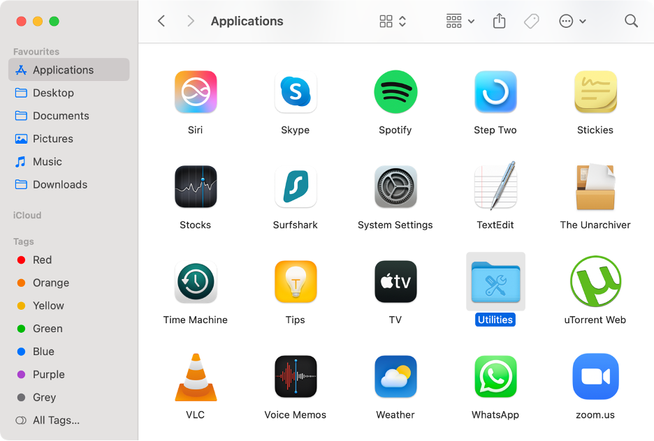 To close background processes on Mac, open the Utilities folder from Applications.