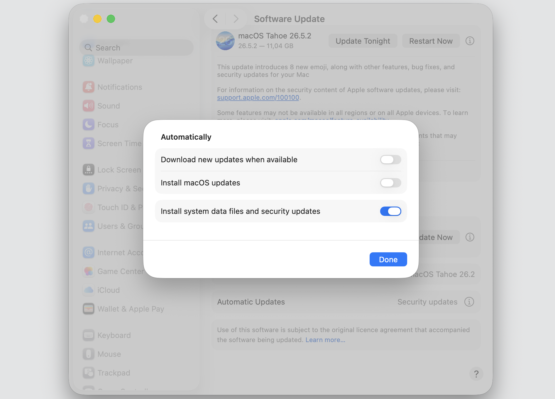 Automatic Updates dialog on a MacBook with Download new updates and Install macOS updates toggled off to reduce installd CPU.