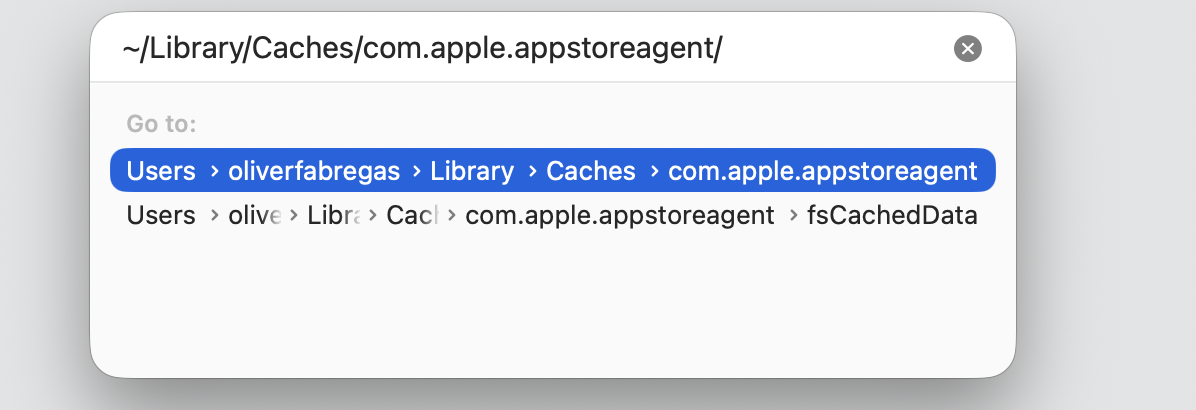 Finder Go to Folder bar on a MacBook with the com.apple.appstore cache path typed to clear files behind installd high CPU.