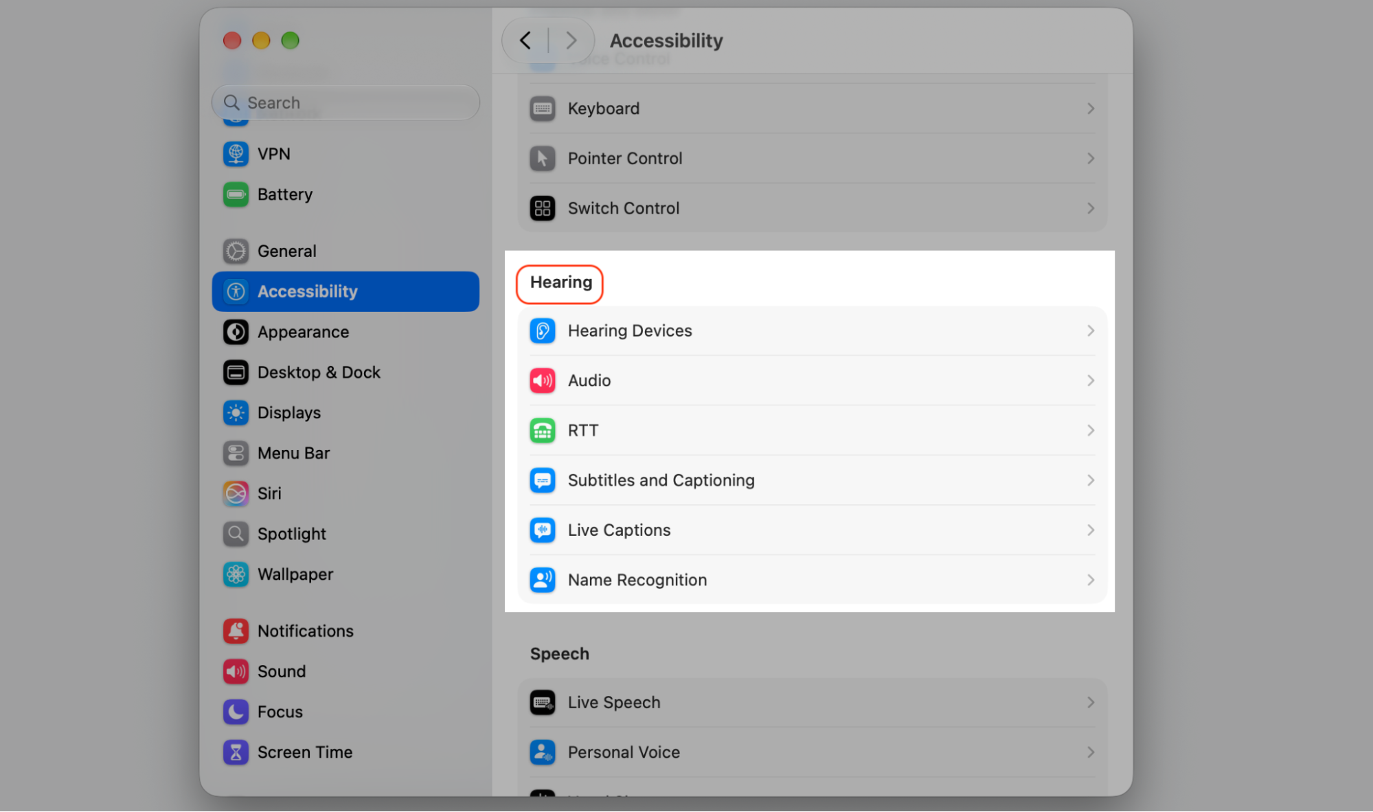 Accessibility section of macOS System Settings showing the Hearing category with Hearing Devices, Audio, RTT, and Live Captions options.