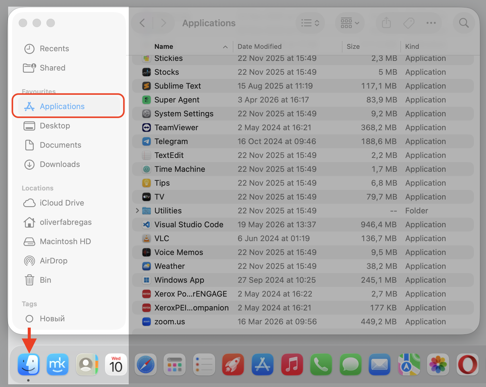 Finder opened on a macOS device with the Applications folder selected in the sidebar, the first step to open Utilities and Activity Monitor.