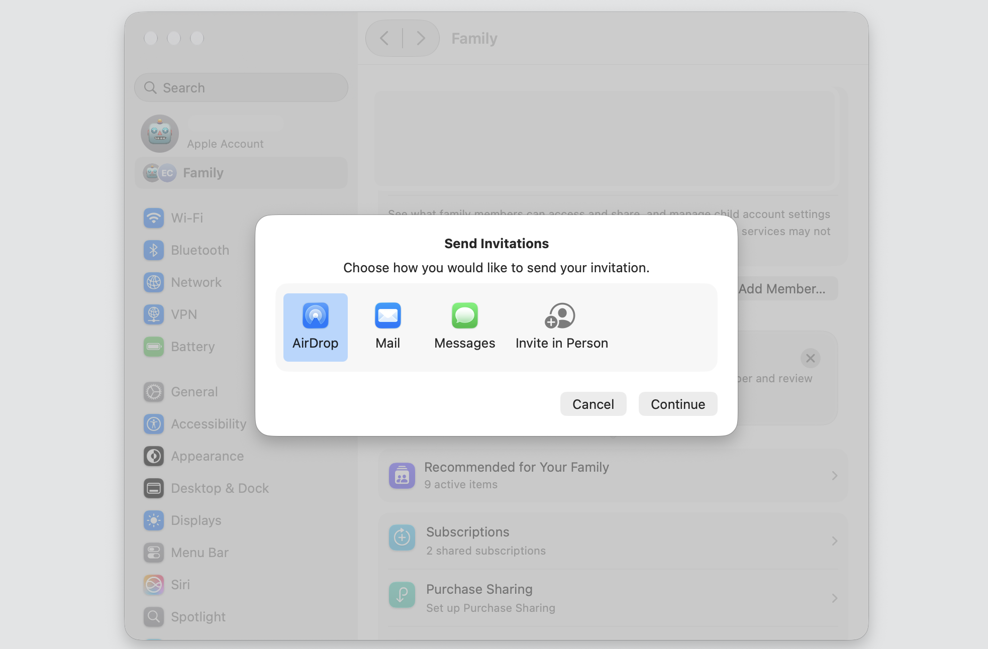 Send Invitations dialog on a MacBook offering AirDrop, Mail, Messages, and Invite in Person to share your iCloud storage with family.