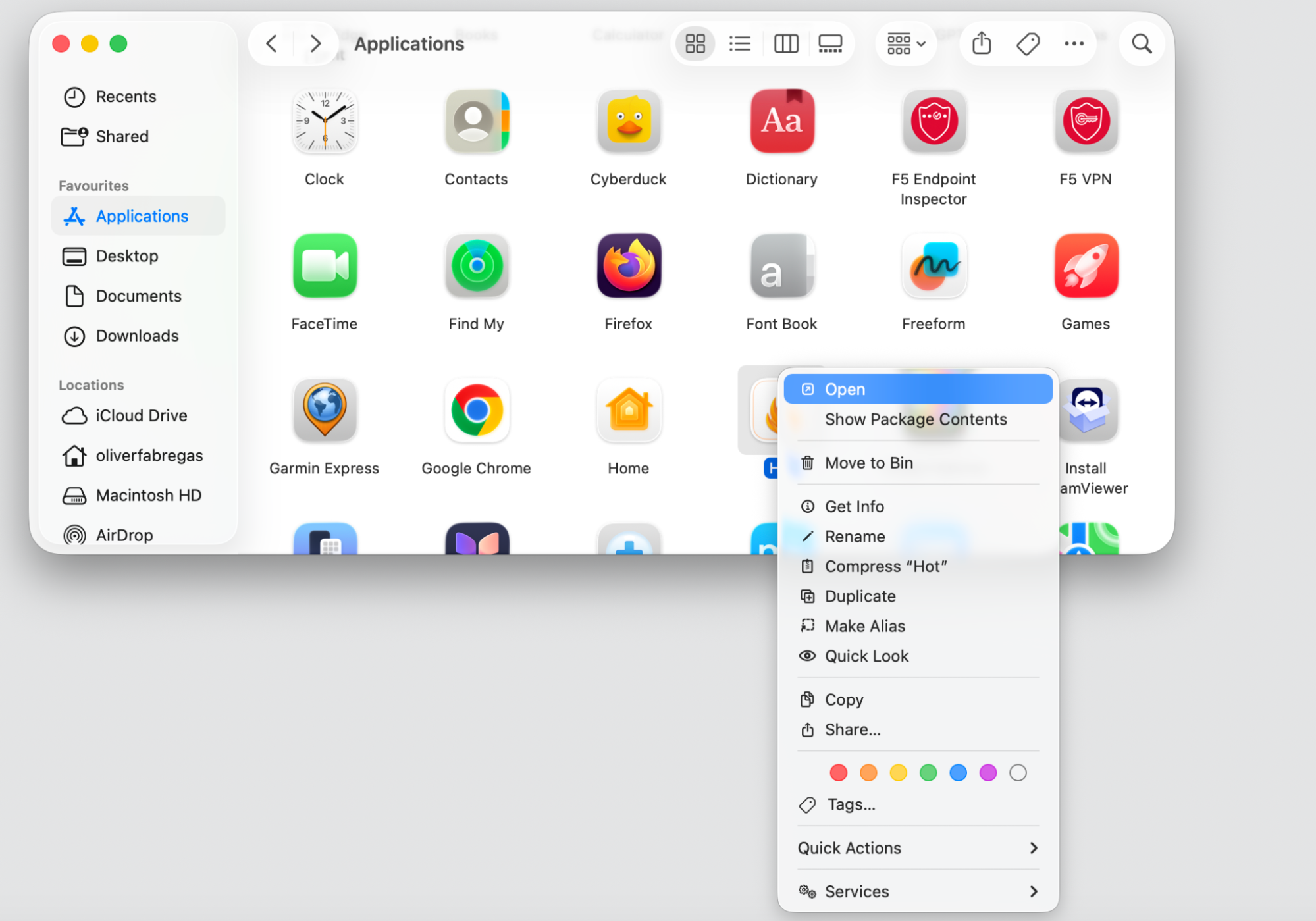 Finder Applications window on a MacBook, control-clicking the Hot app icon to reveal the right-click menu with the Open option shown.