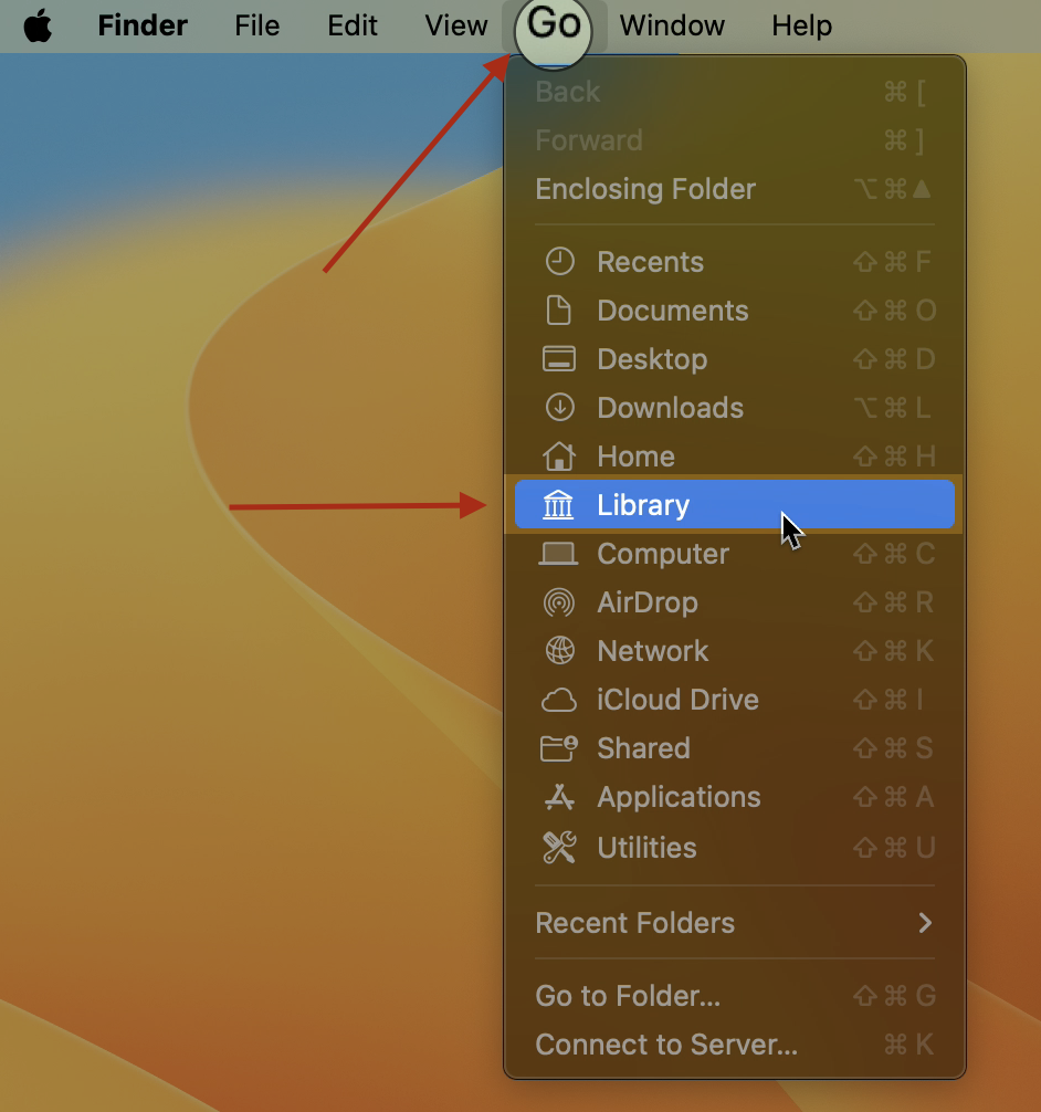 Finder's Go menu open on macOS with the Option key held down to reveal the hidden Library folder option for accessing Spotify leftovers.