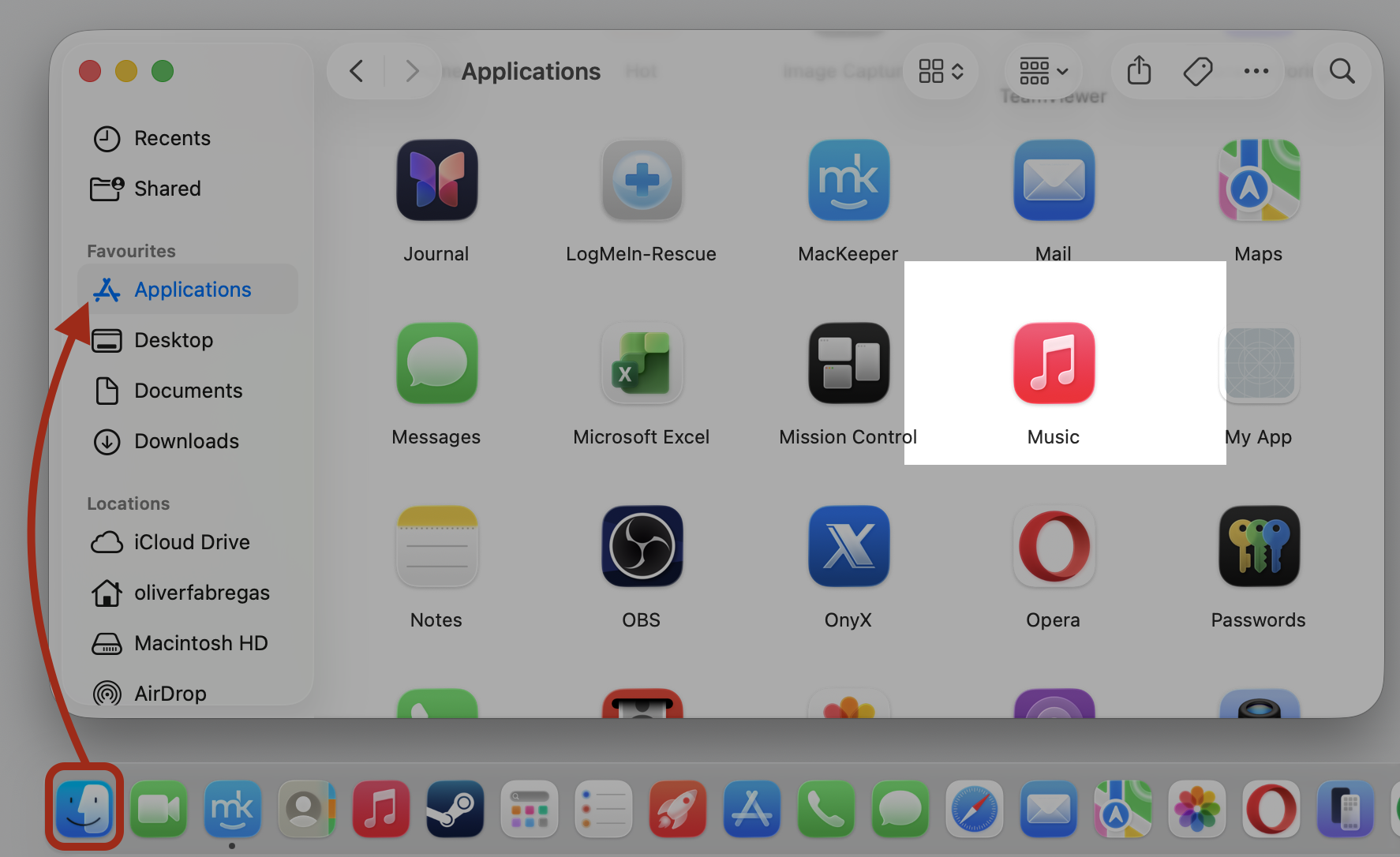 Finder Applications window on a MacBook with the Music app icon highlighted, the first step to remove downloaded Apple Music songs on Mac.