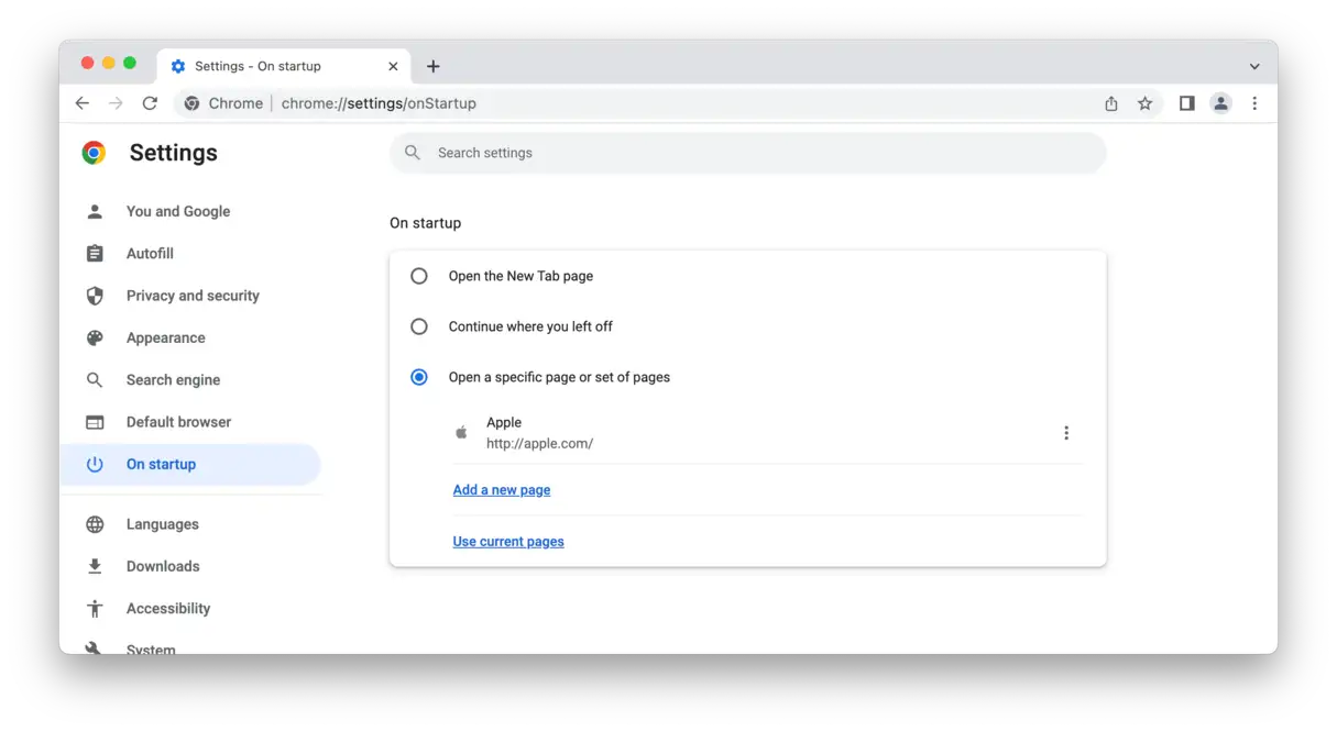 Chrome settings are open on a Mac. Click on On startup > Open a specific page or set of pages to remove AccessibleSearchEngine from Chrome.