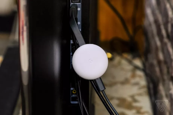Chromecast device connected to a TV set with an HDMI connector
