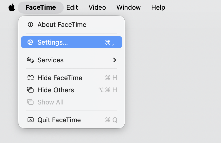 FaceTime app on a MacBook with the Settings menu opened from the menu bar to check the Apple Account linked to FaceTime on macOS.