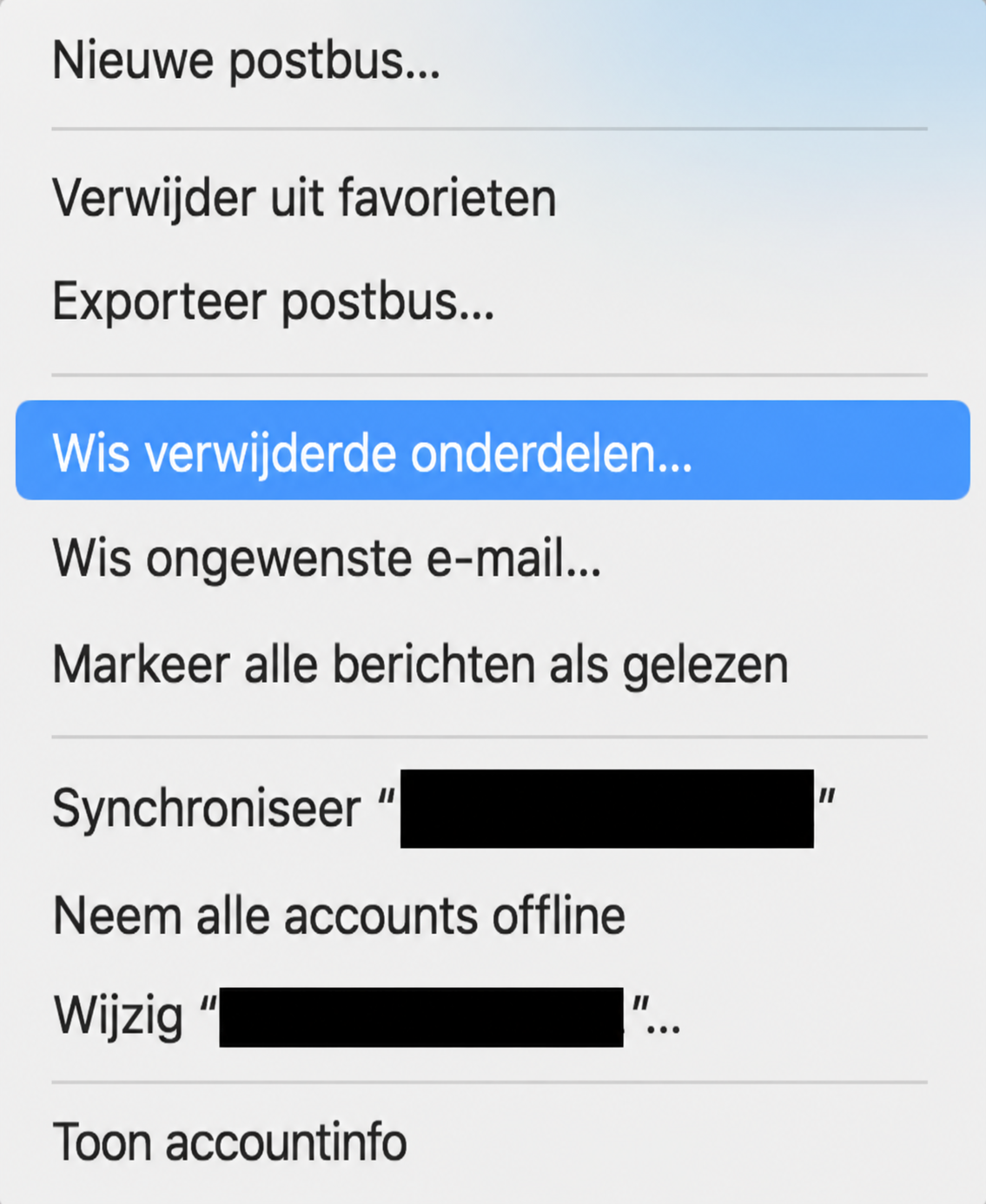 Een deel van een menu in de Apple Mail app met ‘Wis verwijderde items’ geselecteerd. Dit maakt deel uit van een handleiding over hoe je de Mail cache verwijdert door de Prullenmand te legen.