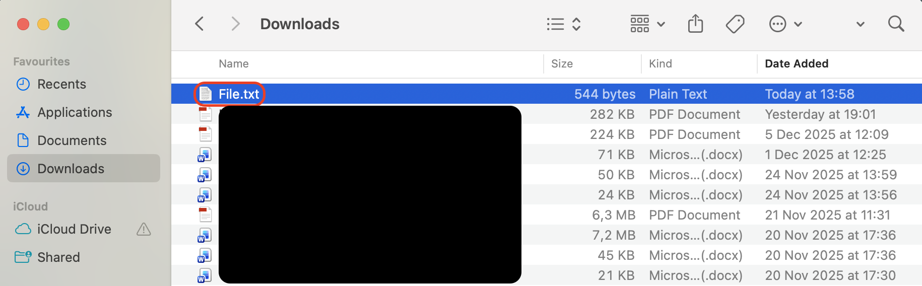 Selecting a file or folder in Finder on macOS to prepare it for dragging, copying, or moving to a new location using mouse or trackpad.