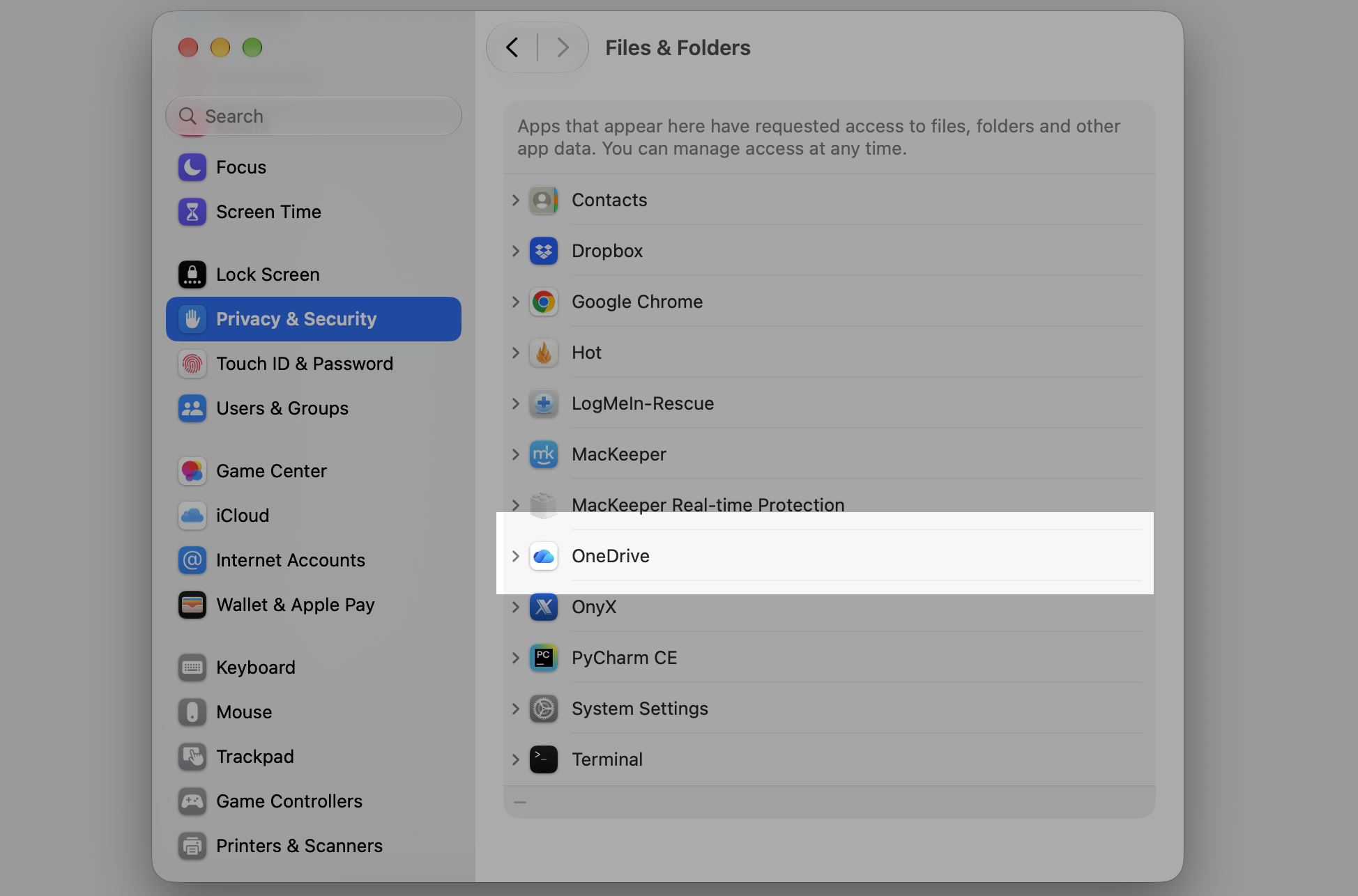The Files & Folders pane in Privacy & Security on an Apple laptop with OneDrive listed to enable access for the reinstalled OneDrive on Mac.