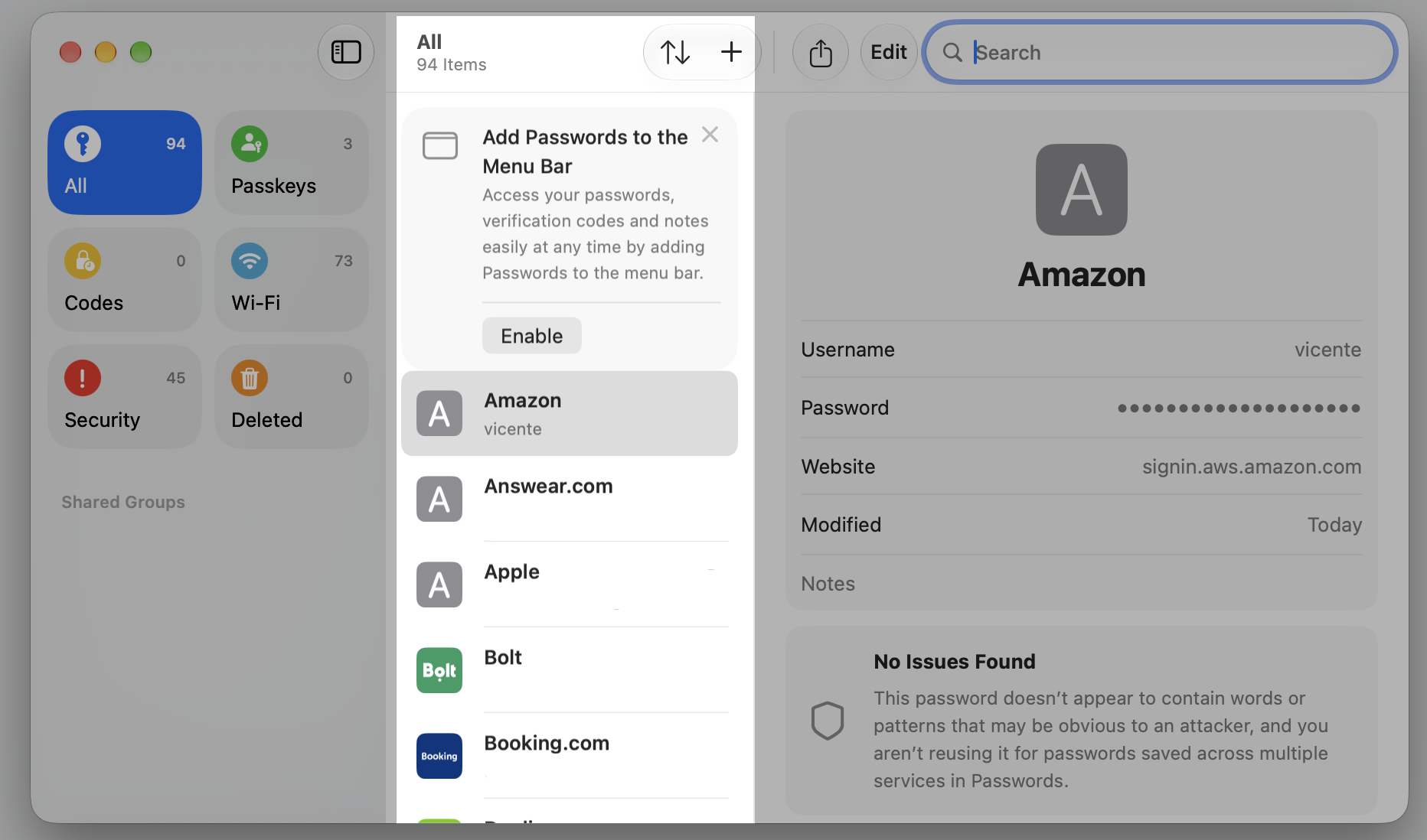 The Passwords app on macOS Sequoia, browsing the list of saved iCloud Keychain logins to find a specific entry on your Apple device.