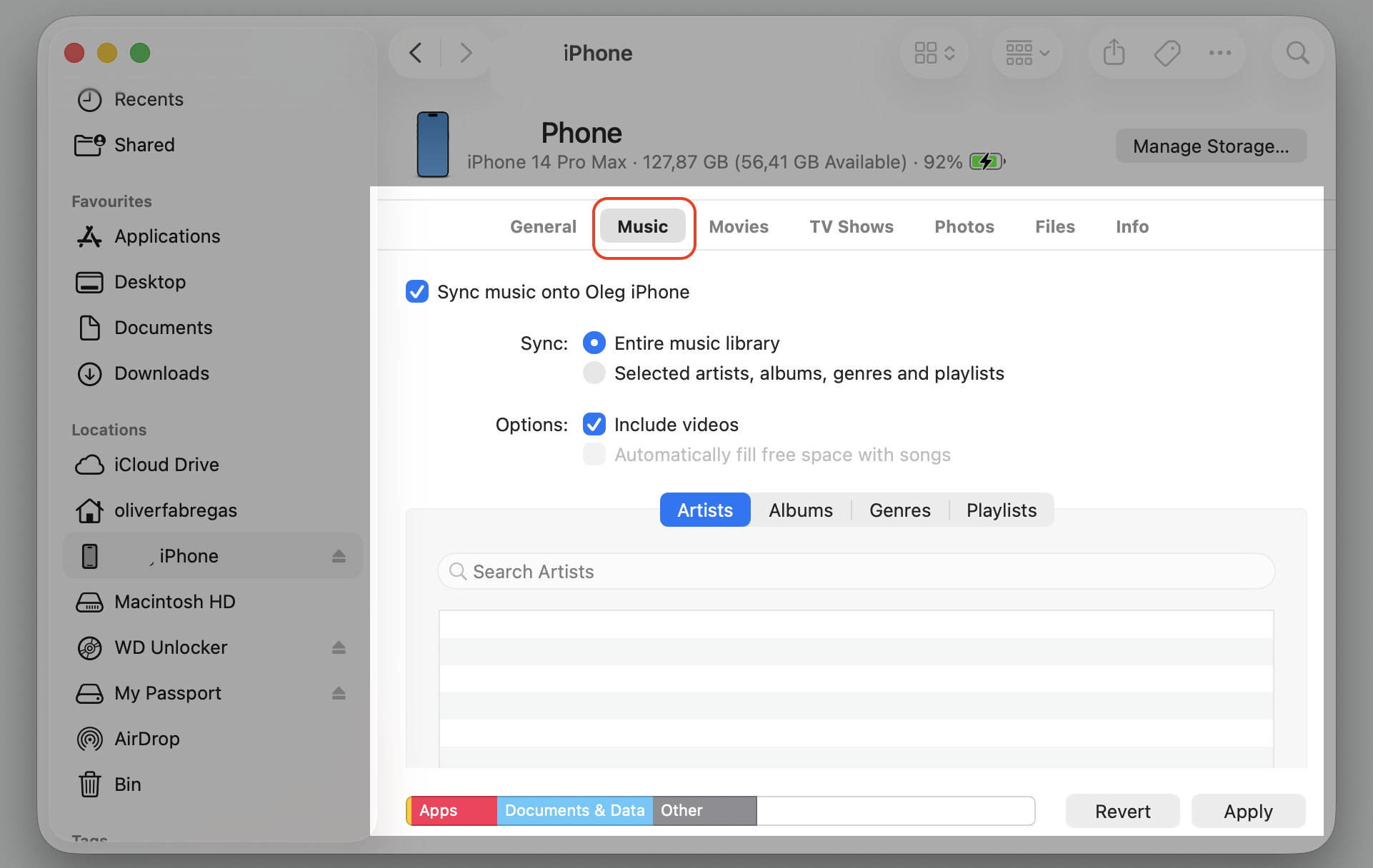 Finder iPhone Music tab on an Apple laptop showing sync music options to review unnecessary synced libraries eating disk space on Mac.