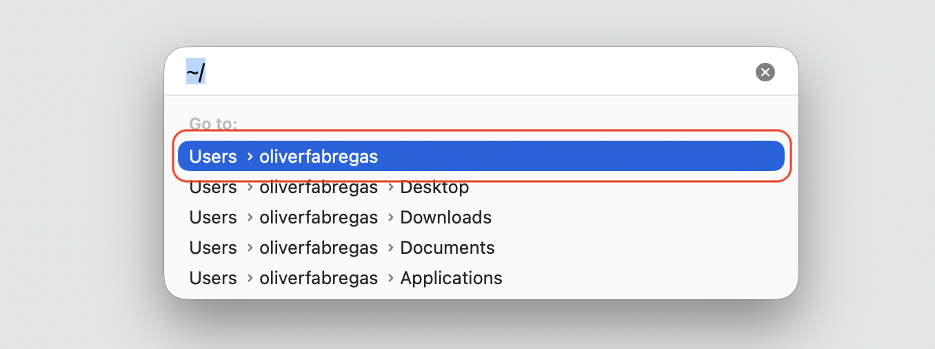 Go to Folder dialog in Finder on macOS with ~/ typed and the Users home folder selected while moving the Music library off an Apple laptop.