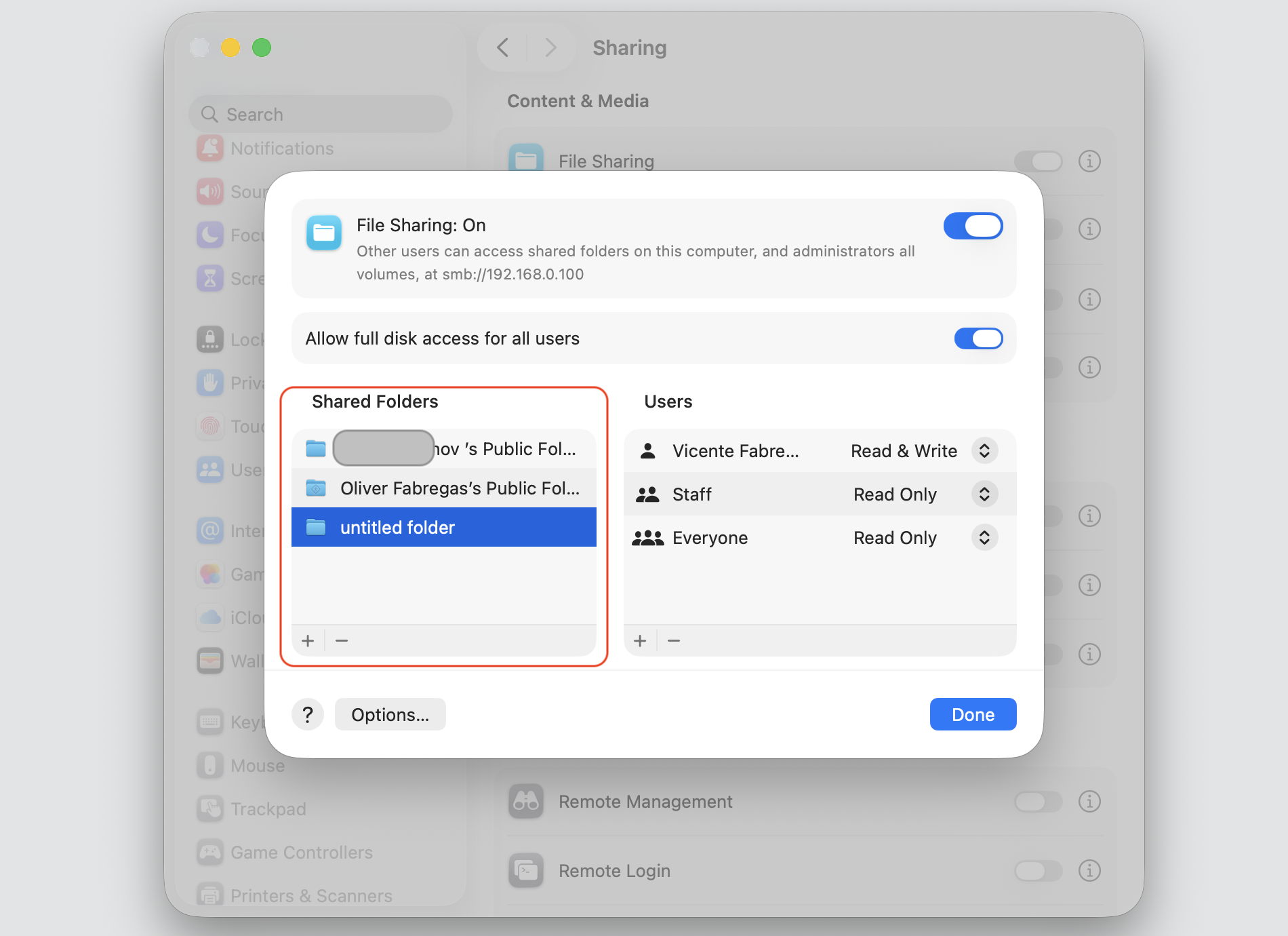 The File Sharing sheet on macOS, where you select a folder in the Shared Folders list to set its file sharing permissions per user.