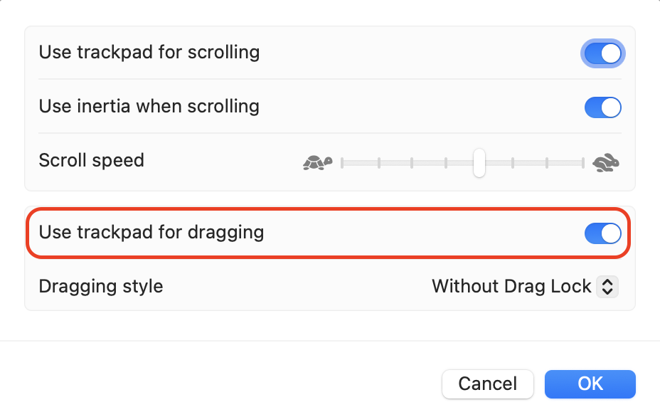 Turning on Use trackpad for dragging in Trackpad Options to allow items to be moved without holding down the trackpad or mouse button continuously.