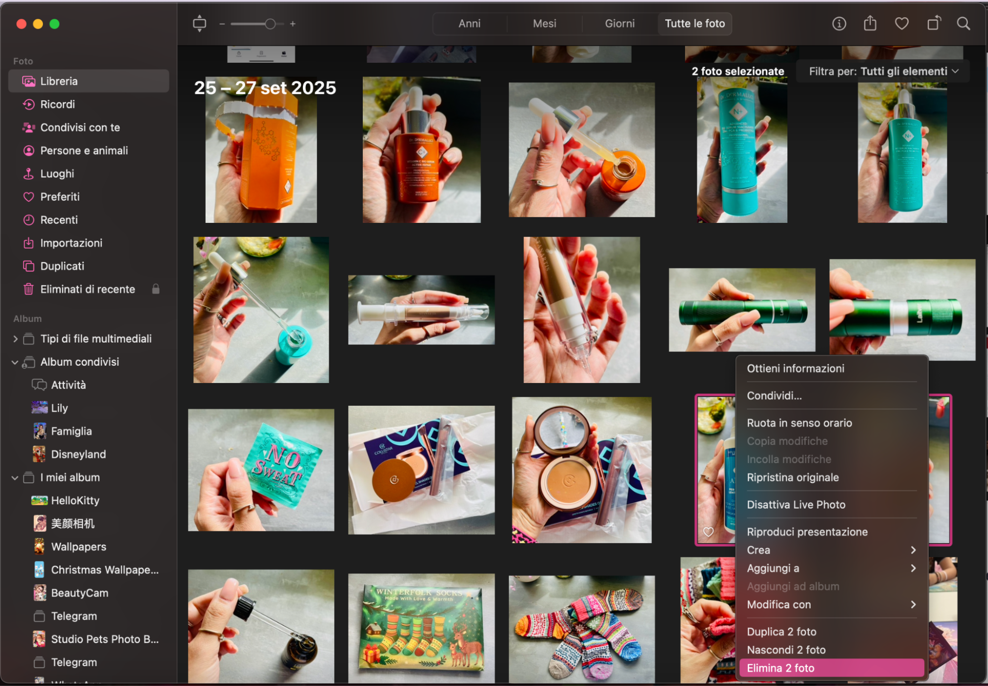 L’opzione Elimina 2 foto è evidenziata nell’app Foto su MacBook per rimuovere le foto.