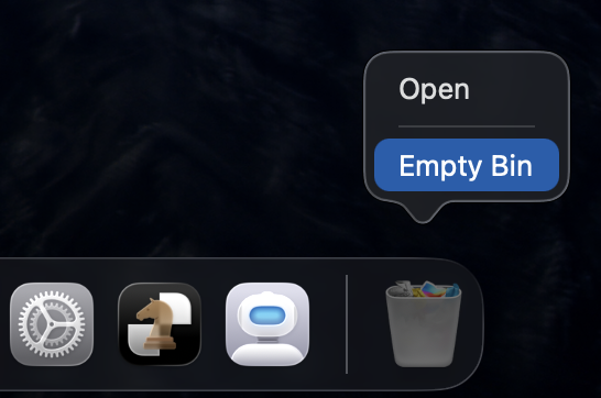 Right-clicking the Bin in the macOS Dock and selecting Empty Bin permanently deletes the damaged app before reinstalling on a MacBook.