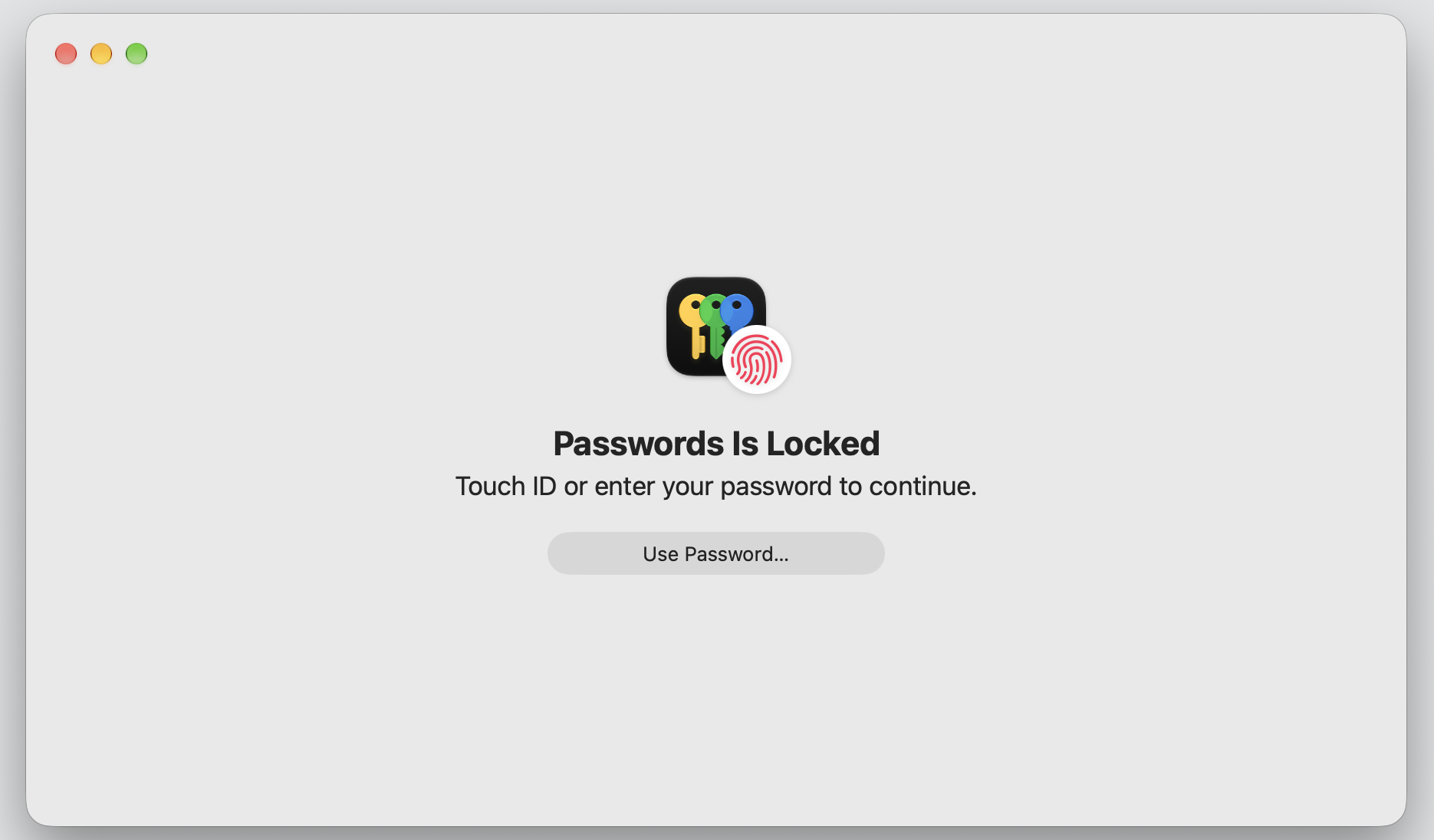 The Passwords app on a MacBook prompting Touch ID or your Mac password to unlock and view saved iCloud Keychain logins securely.