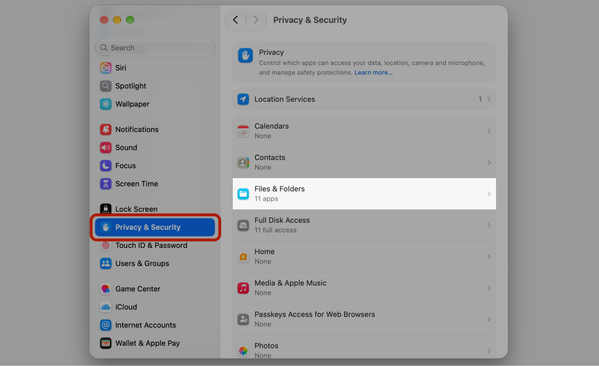 System Settings on macOS with Privacy & Security selected and Files & Folders shown to grant permissions to the reinstalled OneDrive app.