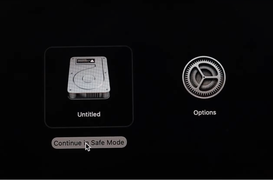 To boot your MacBook into Safe Mode, press and hold Shift, then click Continue in Safe Mode.