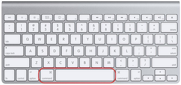 Apple laptop keyboard with the Command and Space keys highlighted to open Spotlight and relaunch Dropbox on macOS quickly.