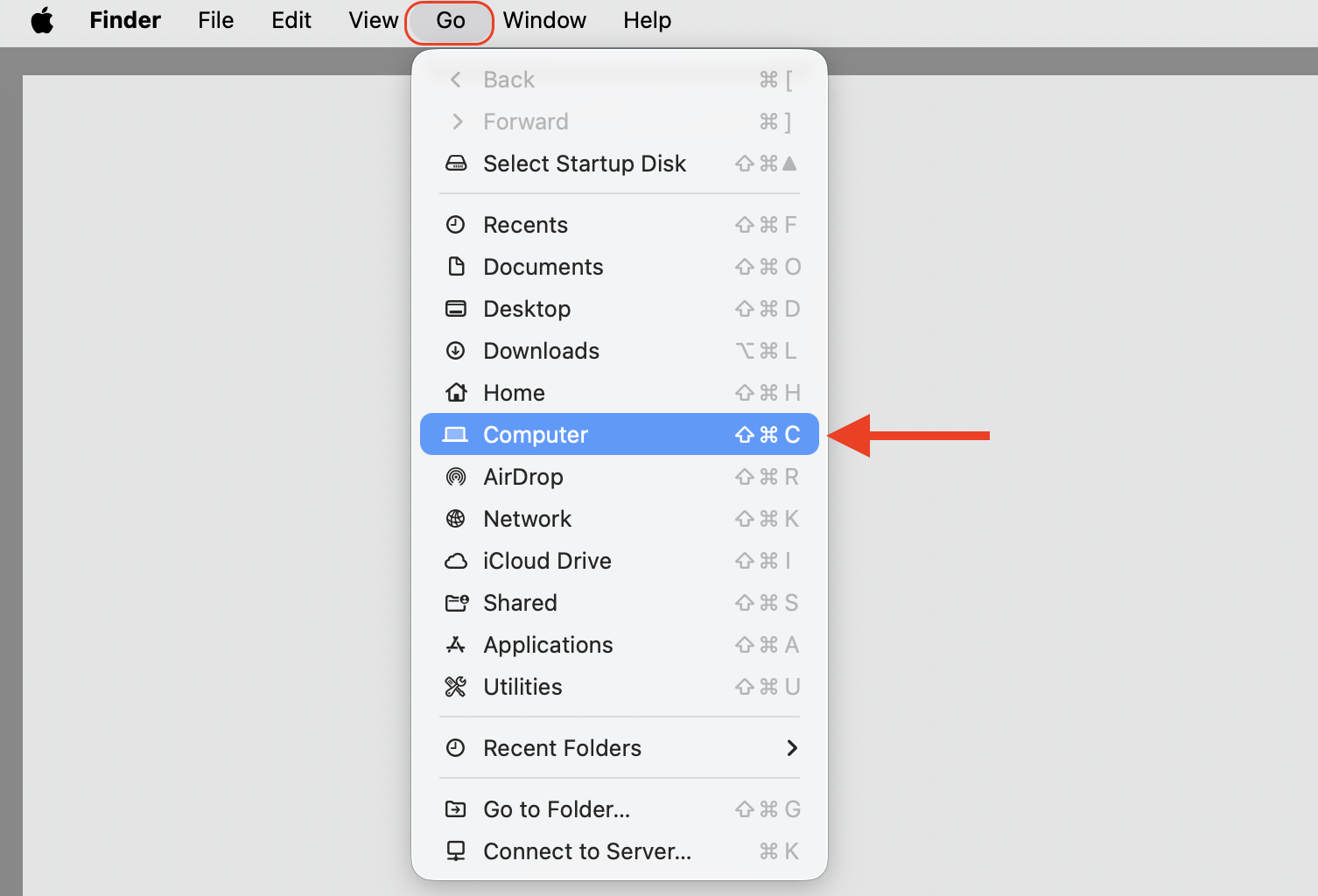 The Finder Go menu open on macOS, where you choose Computer to browse local drives and share files with another user on the same Mac.