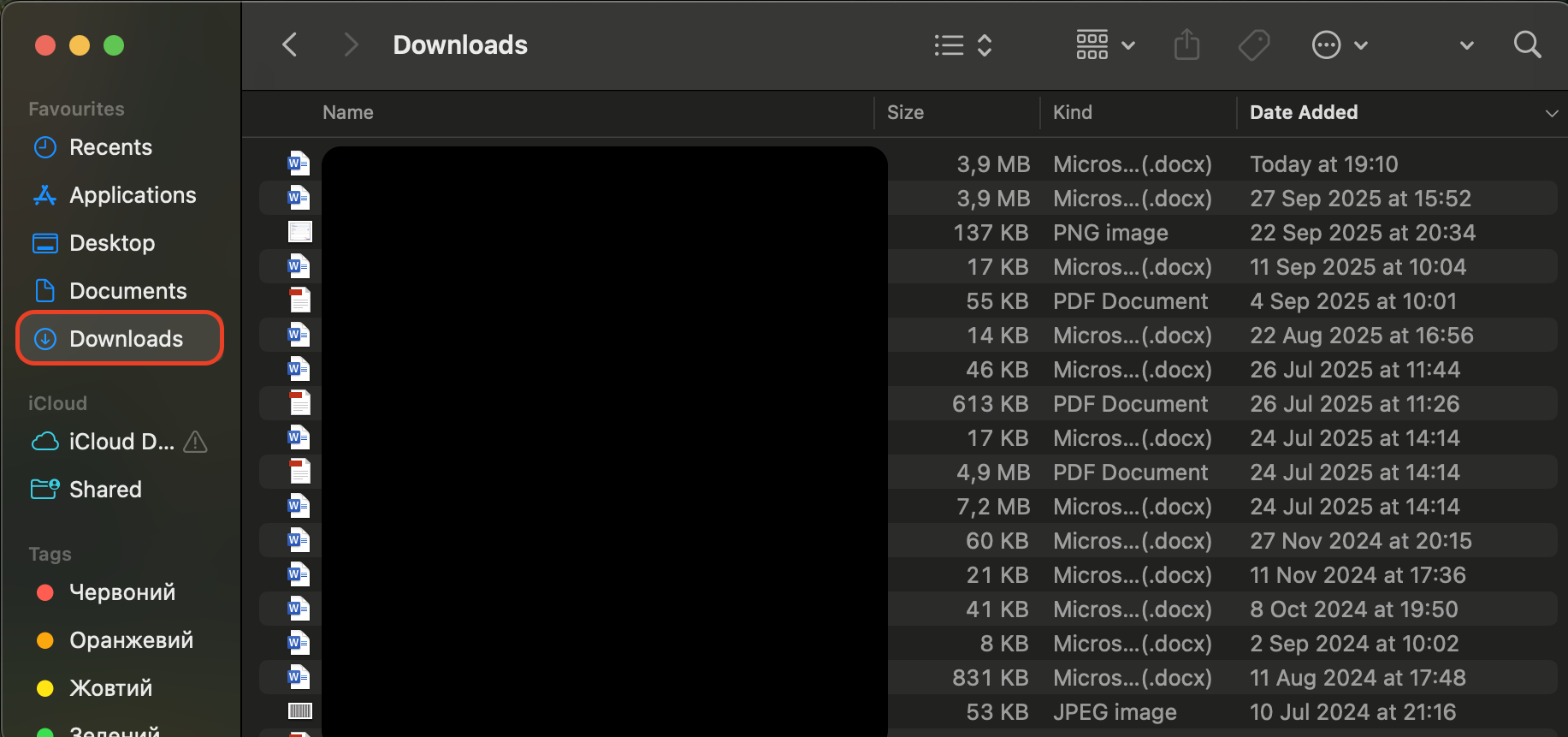 Open Finder, navigate to the Downloads folder, review the contents, and delete any unwanted media or files to free up storage space on your Mac.