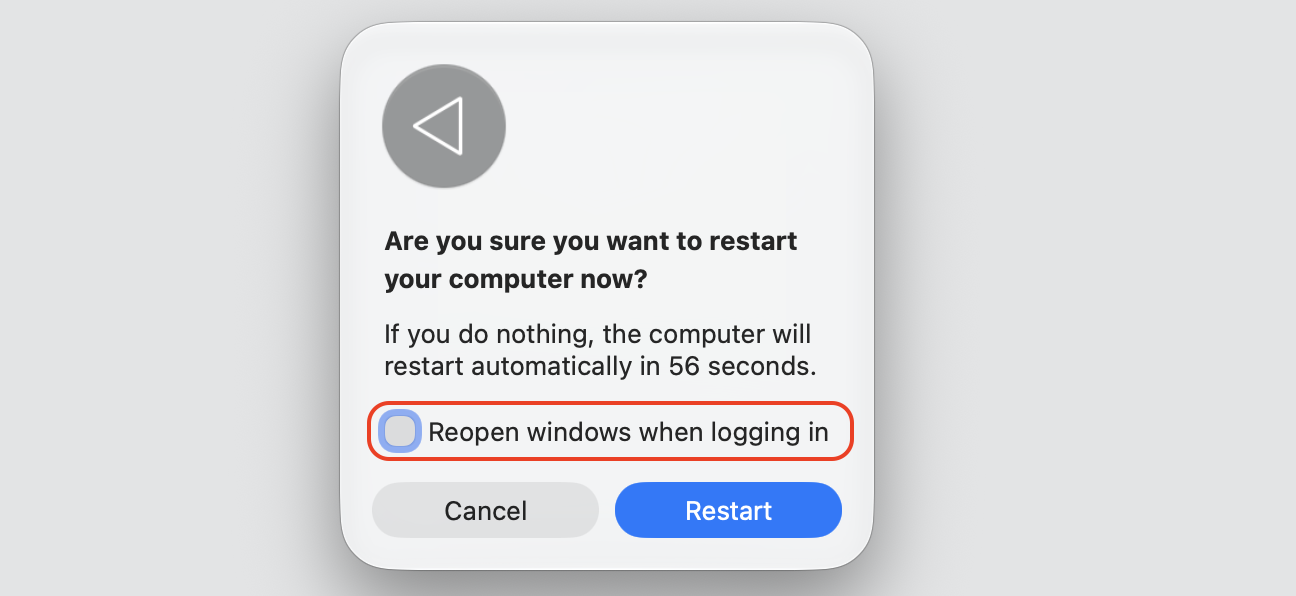 The Restart dialog on a MacBook with Reopen windows deselected before clicking Restart to clear apps not opening on Mac.