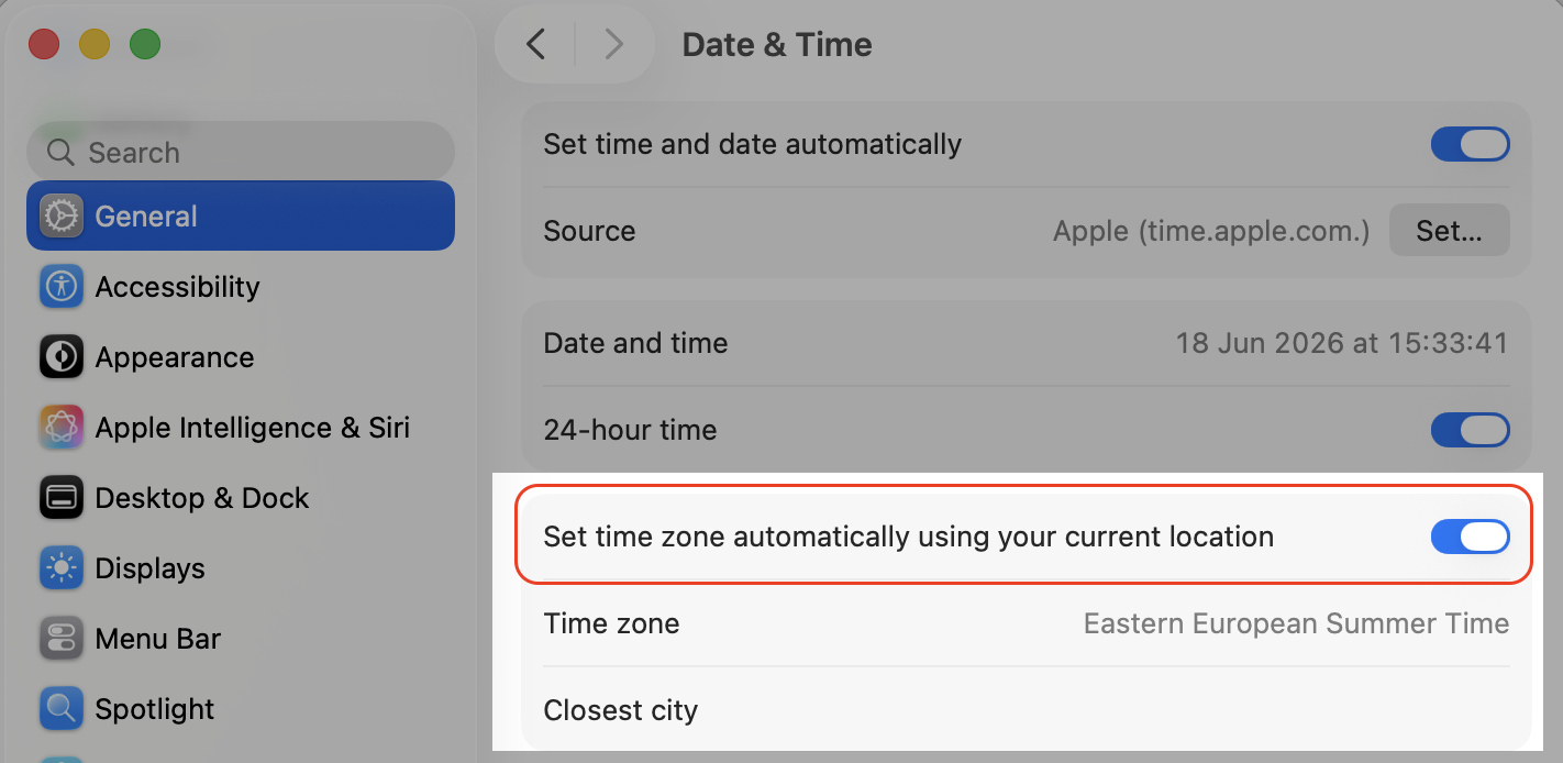 Date & Time pane in macOS Tahoe, turning on Set time zone automatically using your current location on a MacBook laptop.