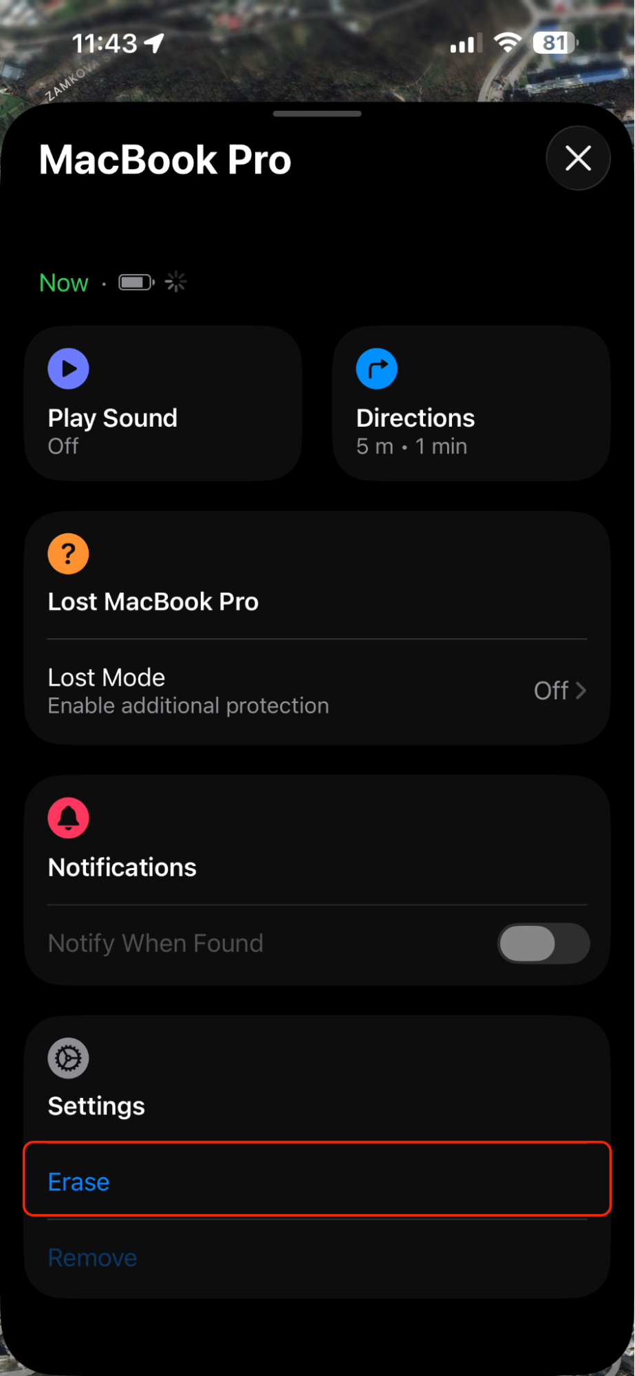 Find My app on an iPhone showing the selected Mac's panel swiped up to reveal the Erase This Device option for a remote factory reset.