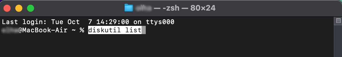 A Terminal window is opened on a Mac. To use Terminal to check or repair the disk, enter the command diskutil list and press Return.