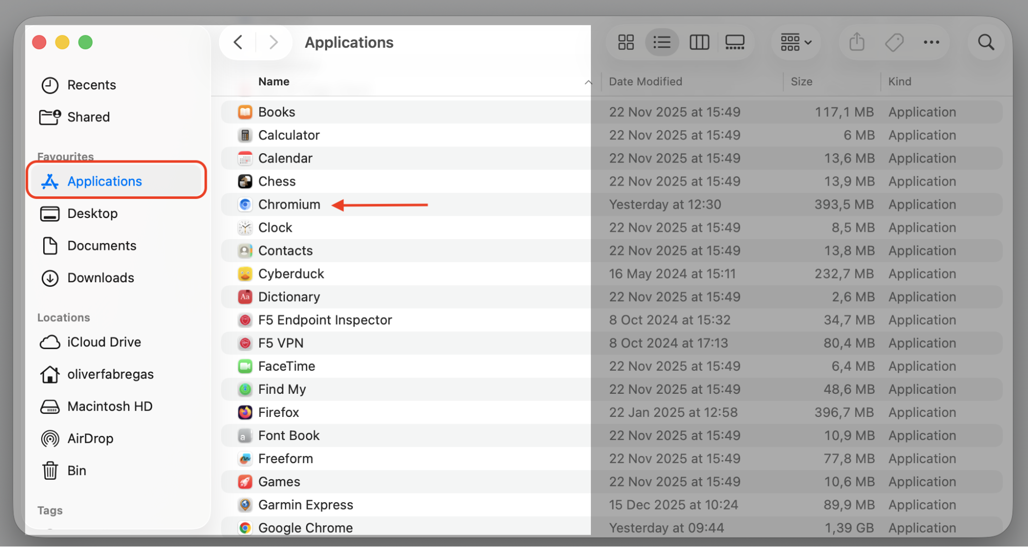 The Applications folder in Finder on an iMac with the Chromium browser app highlighted before uninstalling it from the Apple device.