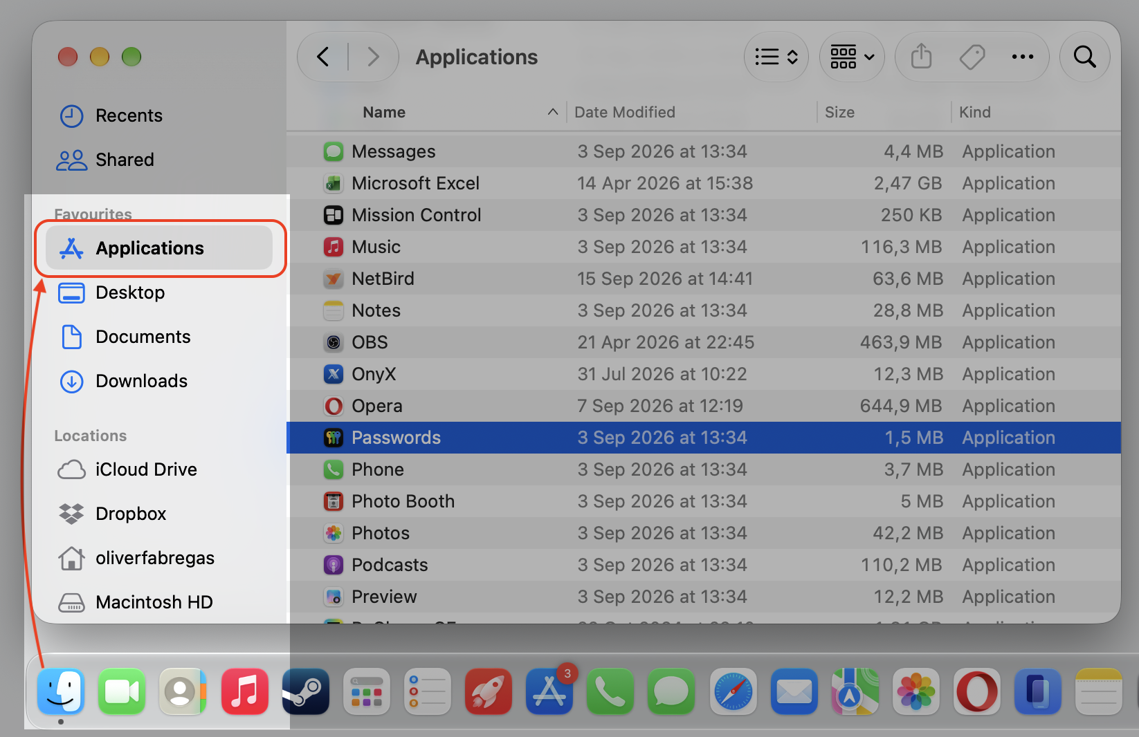 A Finder window on macOS showing the Applications folder, where you open the Passwords app to view saved iCloud Keychain logins on a Mac.
