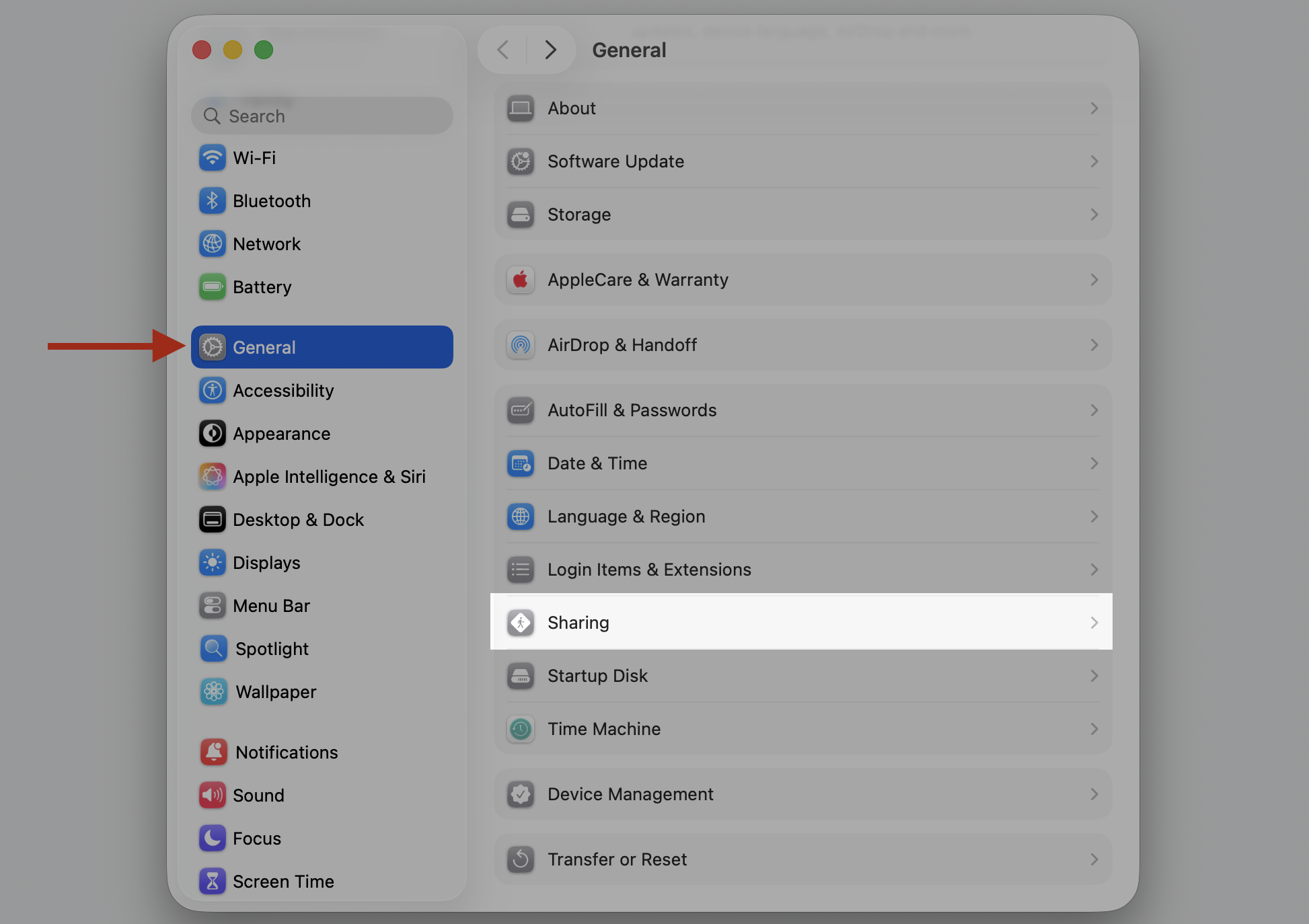 The System Settings window on a MacBook, where you select General in the sidebar then click Sharing to manage sharing permissions.