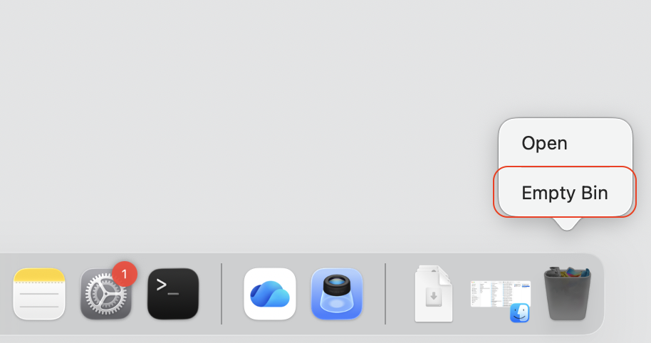 macOS Bin window with Empty selected to permanently delete the OneDrive cache files removed from your MacBook Library folder.