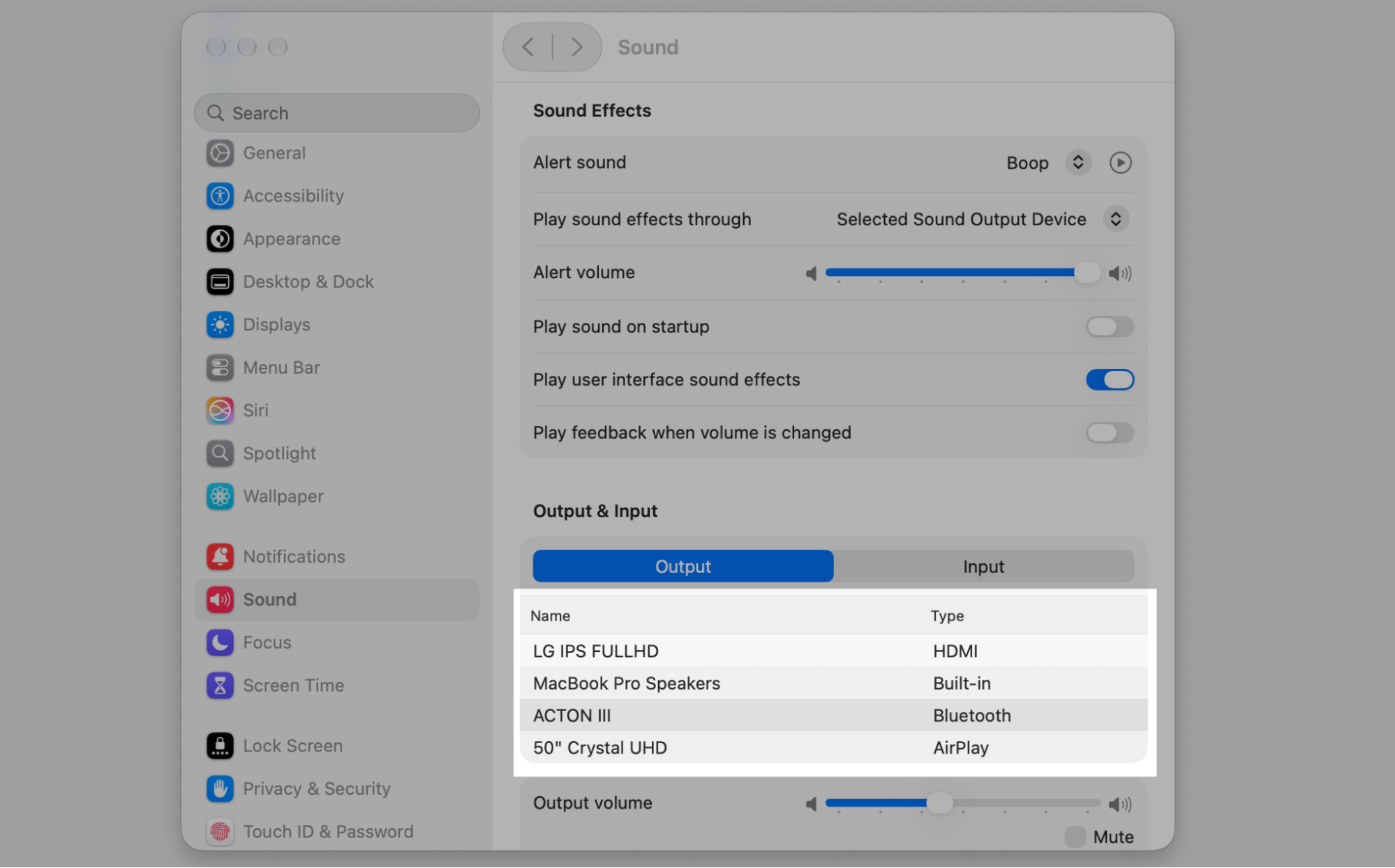 Sound settings on a Mac with the Output device list highlighted, letting you pick built-in, HDMI, Bluetooth, or AirPlay speakers.