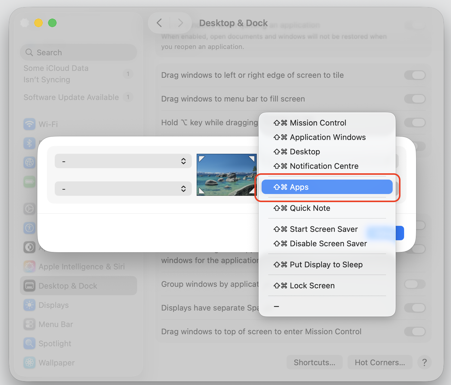 The Hot Corners menu in macOS Tahoe with the Apps option highlighted to launch the Spotlight app view from a corner on an iMac.