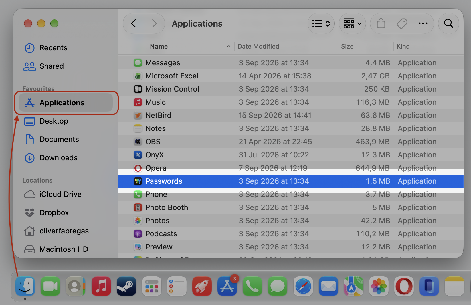 The Applications folder on an Apple computer, opening the Passwords app to browse and view your saved iCloud Keychain passwords.