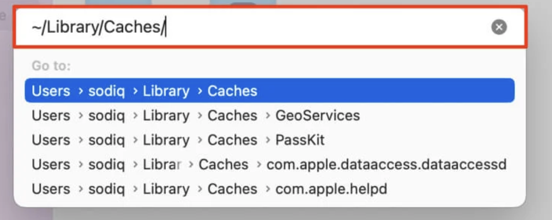 In the search bar, type in the following path: ~/Library/Caches/ and press Enter. This will take you to where all your cache files will be sorted.